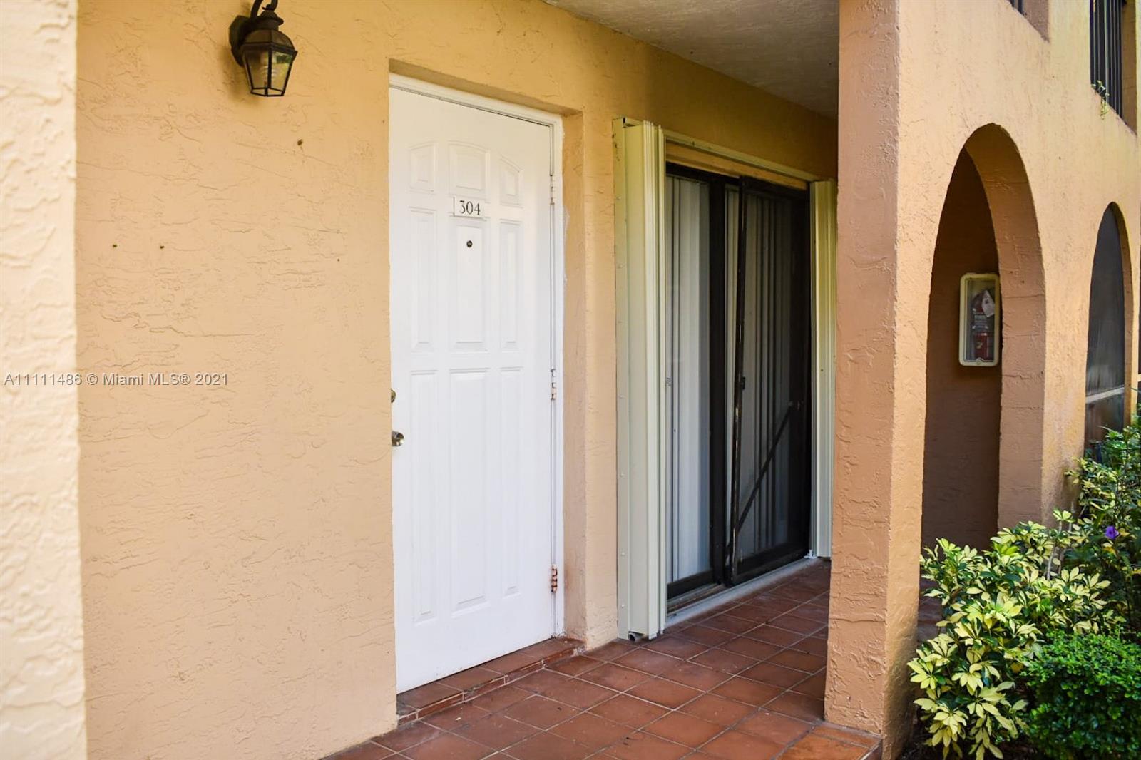 18280 Mediterranean Boulevard, Unit 43 Hialeah, FL 33015 - Photo 3 of 28 a view of a mirror with front door