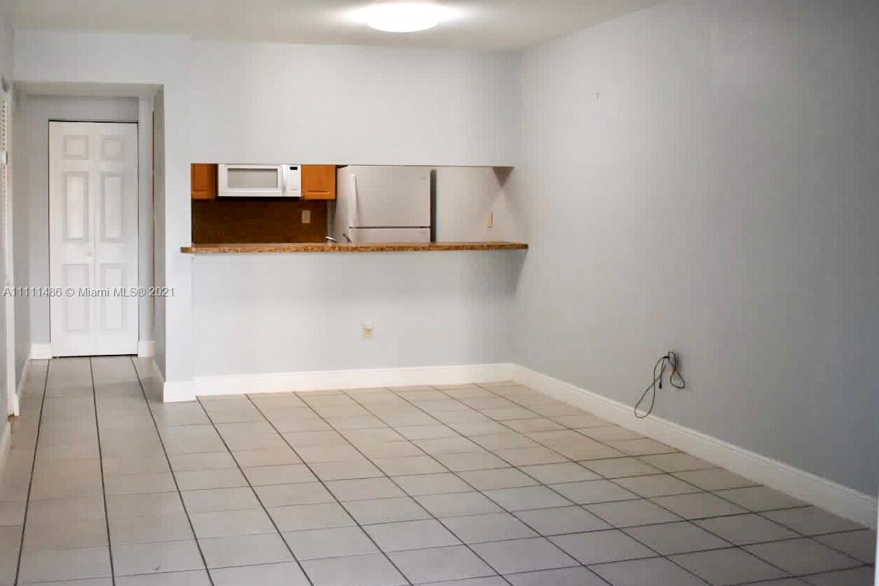 18280 Mediterranean Boulevard, Unit 43 Hialeah, FL 33015 - Photo 6 of 28 a view of a livingroom with an empty space and a sink