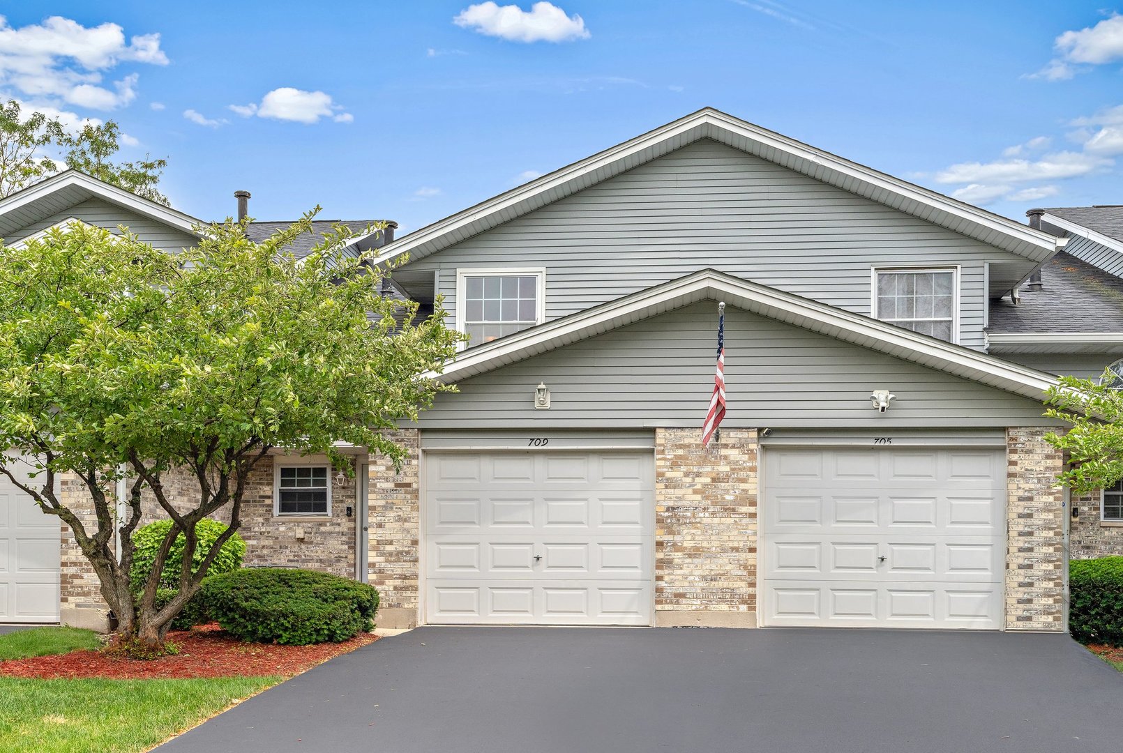 709 Meadows Boulevard Addison, IL 60101 - Photo 1 of 22 a front view of a house with a yard