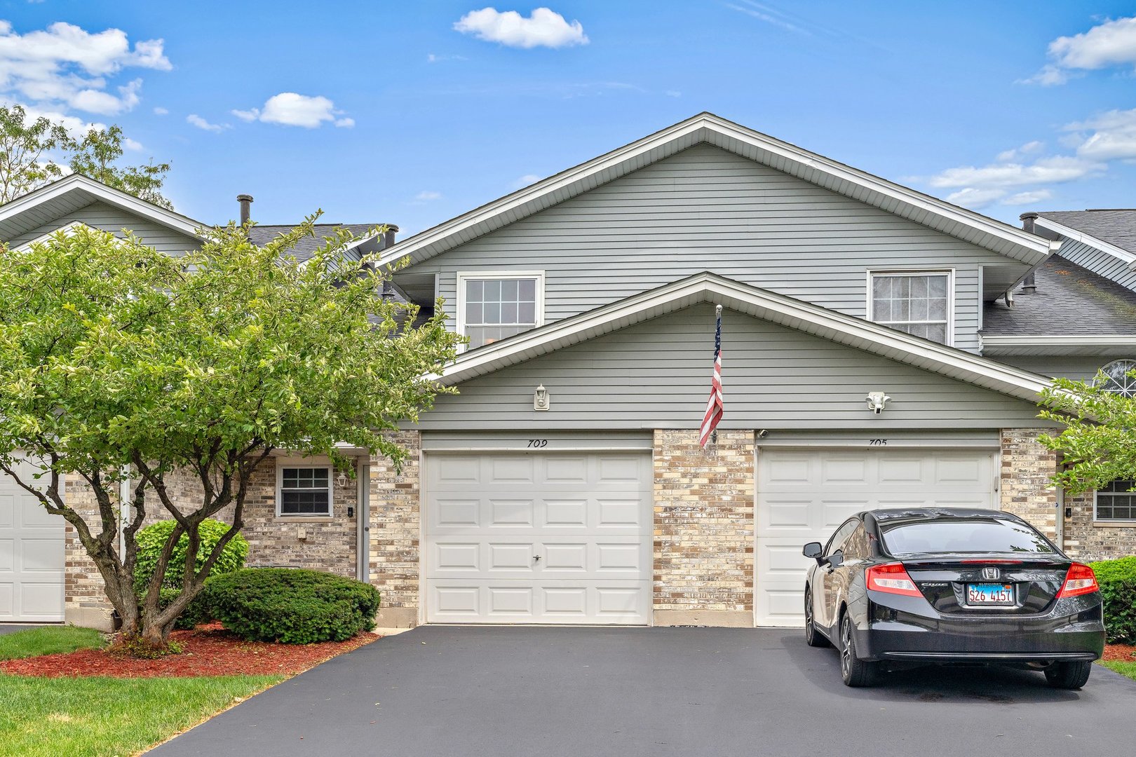 709 Meadows Boulevard Addison, IL 60101 - Photo 19 of 22 a car parked in front of a house