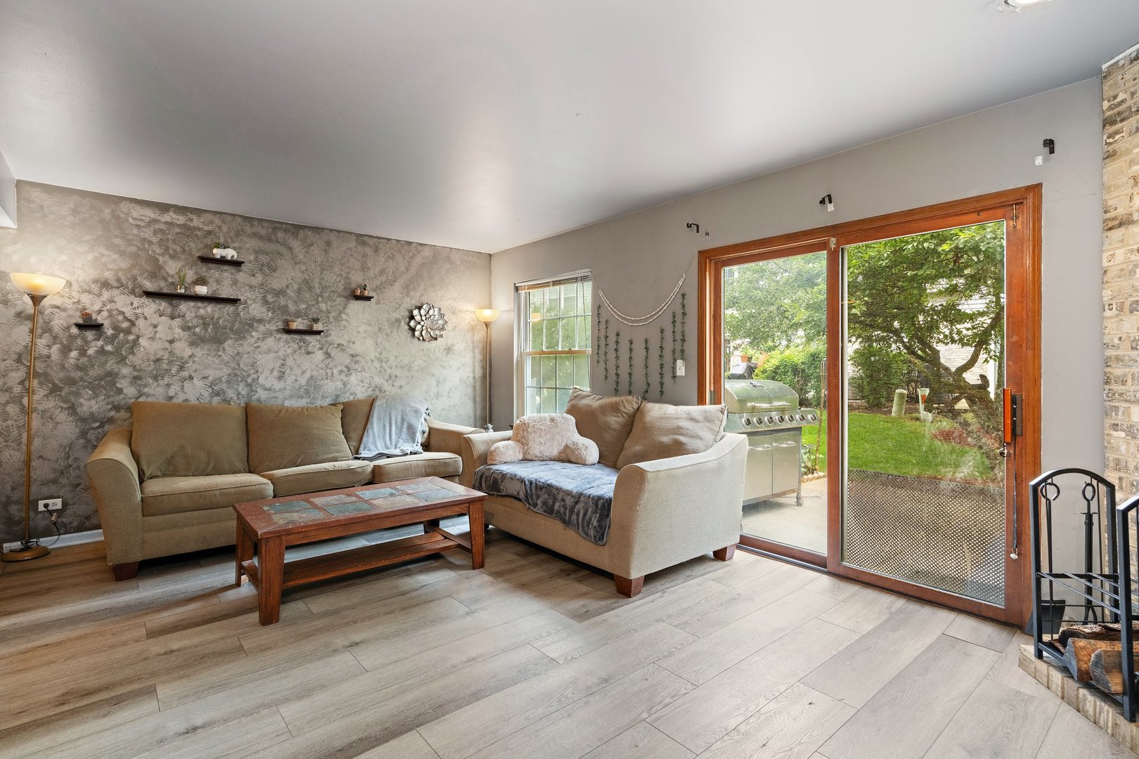 709 Meadows Boulevard Addison, IL 60101 - Photo 8 of 22 a living room with furniture and a floor to ceiling window