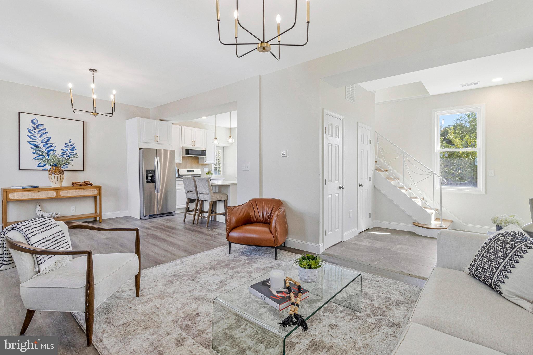 2140 32nd Street Southeast Washington, DC 20020 - Photo 12 of 50 a living room with furniture a rug and kitchen view