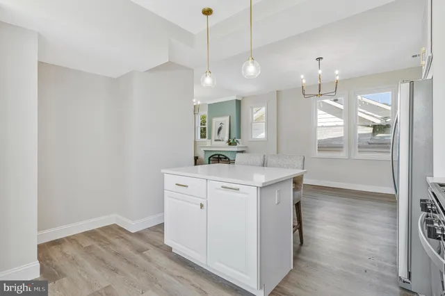 a view of a kitchen counter space with wooden floor