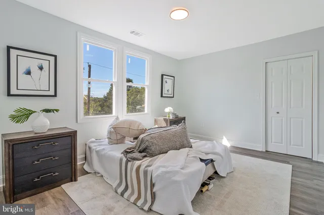 a bedroom with a bed and window