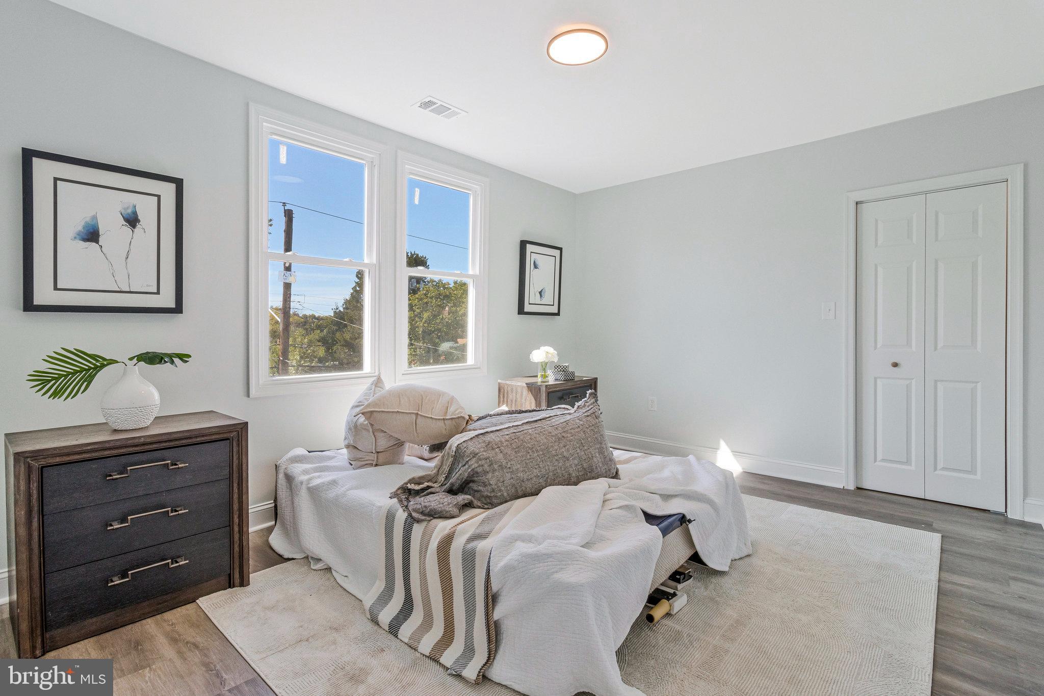 2140 32nd Street Southeast Washington, DC 20020 - Photo 24 of 50 a bedroom with a bed and window