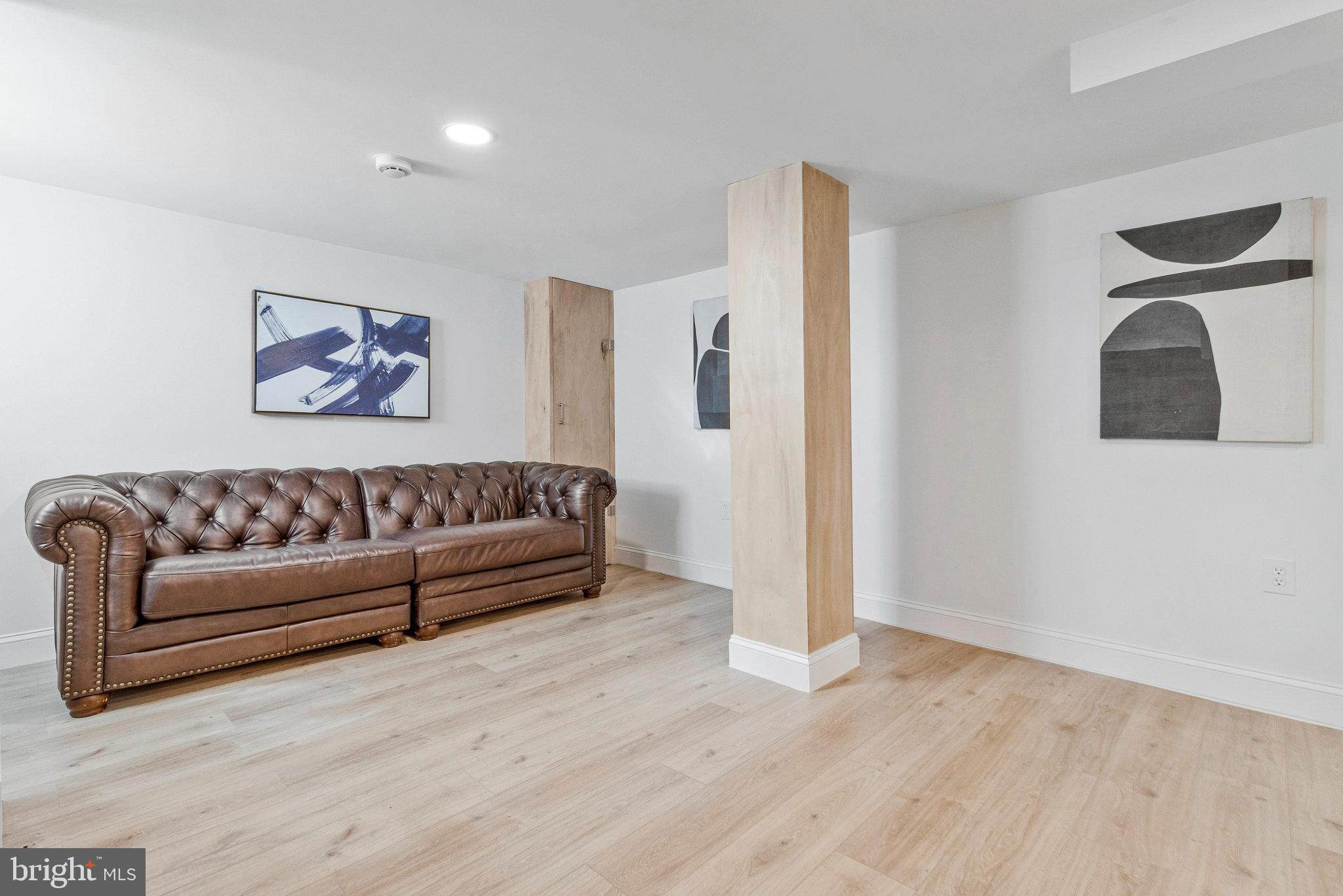 2140 32nd Street Southeast Washington, DC 20020 - Photo 37 of 50 a living room with furniture and a wooden floor