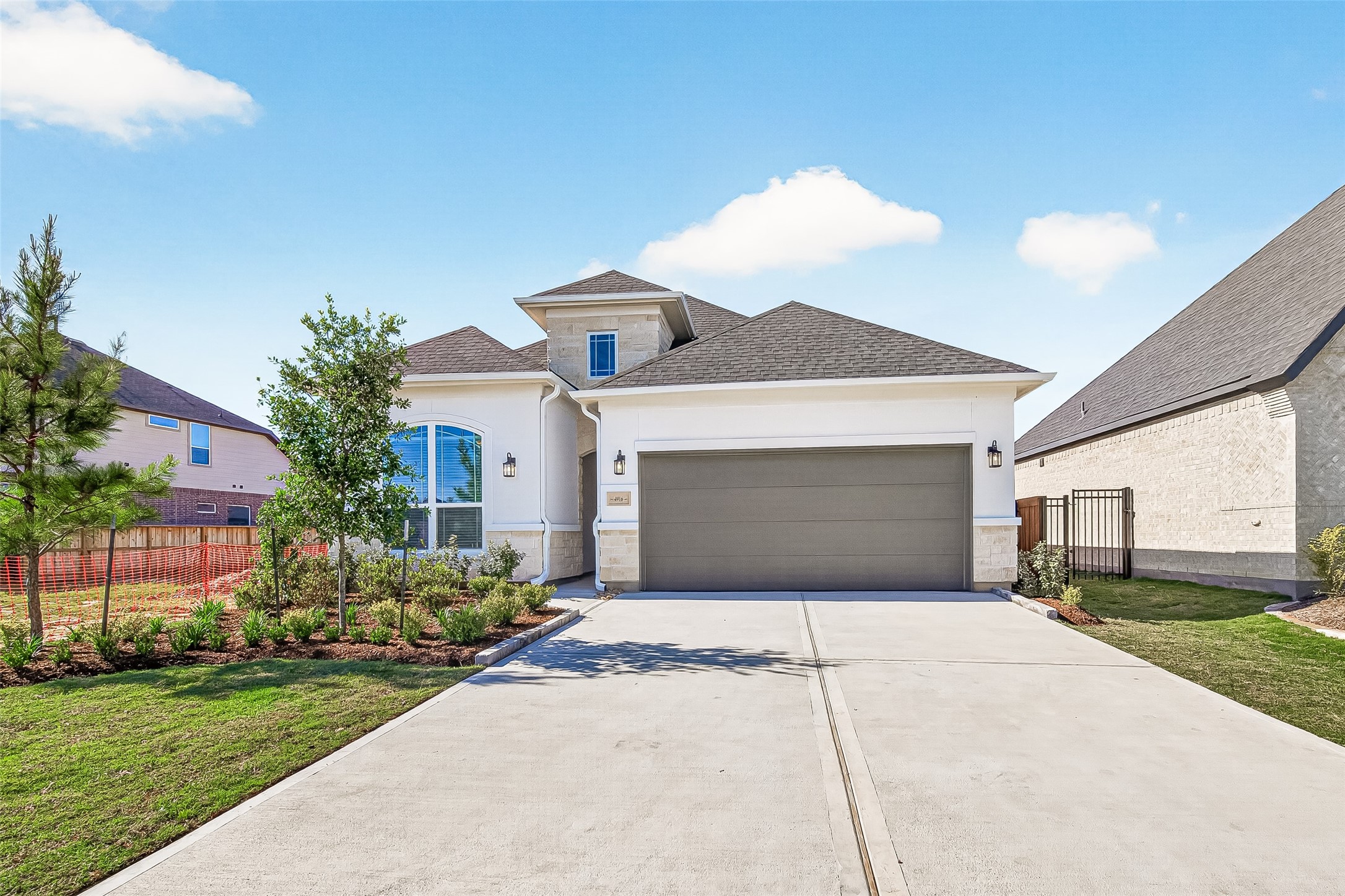 4916 Northern Wds Drive Spring, TX 77386 - Photo 1 of 44 a front view of a house with a yard and garage