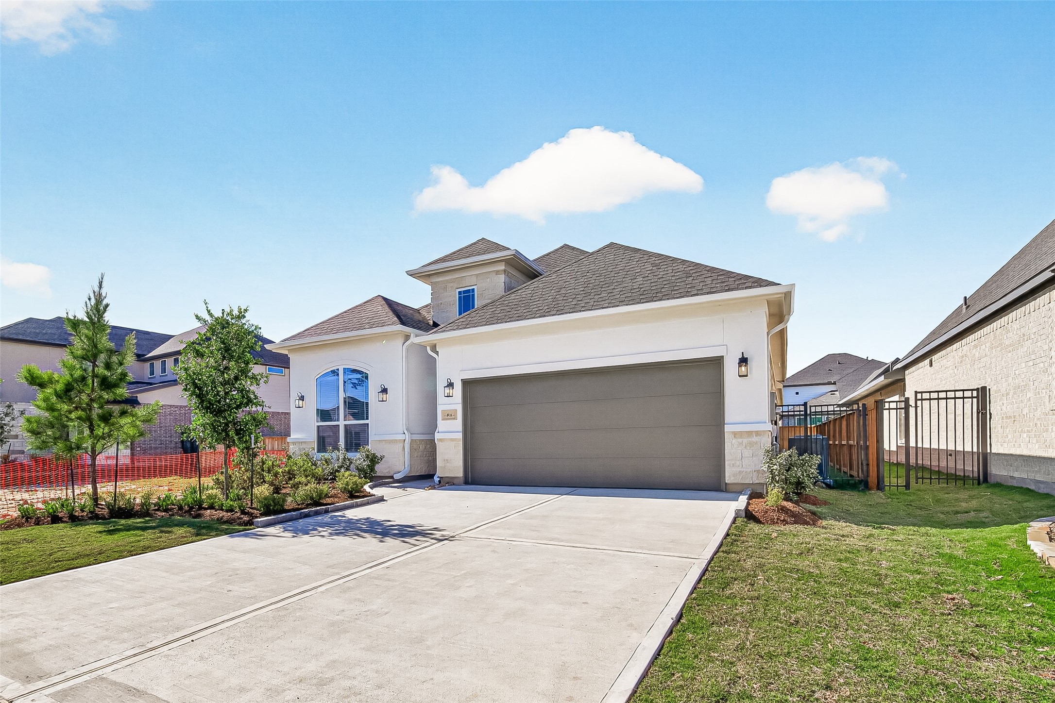4916 Northern Wds Drive Spring, TX 77386 - Photo 2 of 44 a front view of a house with a yard and garage