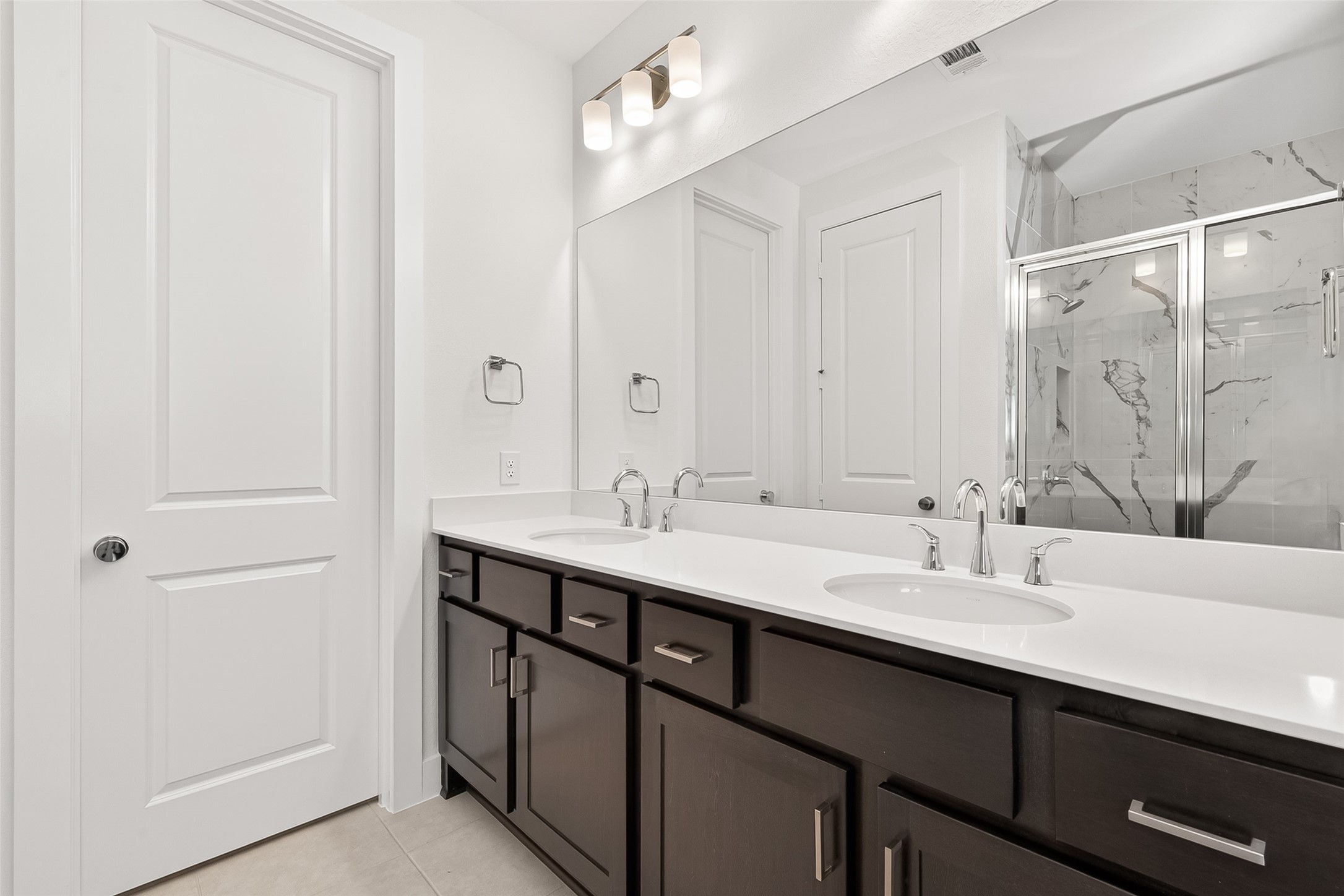 4916 Northern Wds Drive Spring, TX 77386 - Photo 37 of 44 a bathroom with a double vanity sink a and mirror