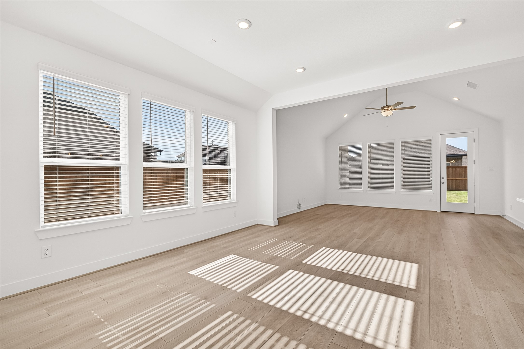 4916 Northern Wds Drive Spring, TX 77386 - Photo 4 of 44 a view of an empty room with a window and wooden floor