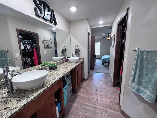 a bathroom with sink and a mirror