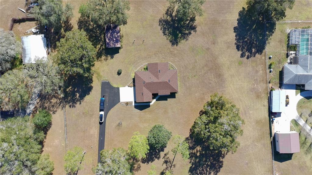 35324 Blanton Road Dade City, FL 33523 - Photo 2 of 49 an aerial view of a house with outdoor space