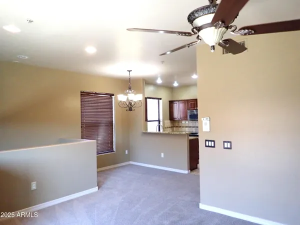 a kitchen with stainless steel appliances granite countertop a sink a cabinets and a window