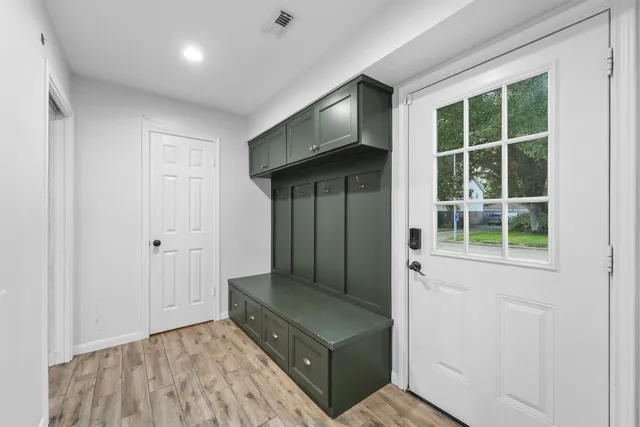 a living room with a furniture and a window