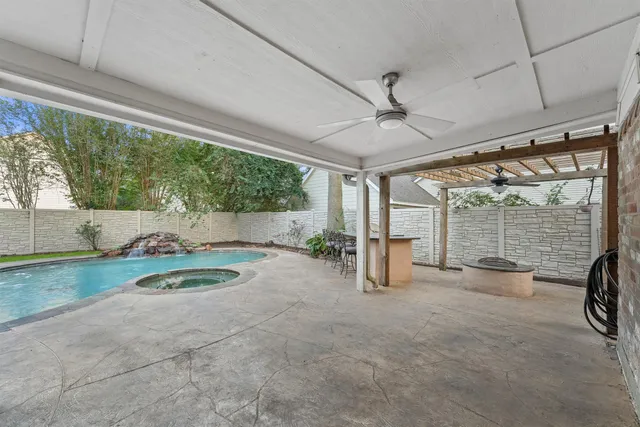 a view of a livingroom with furniture and floor to ceiling window
