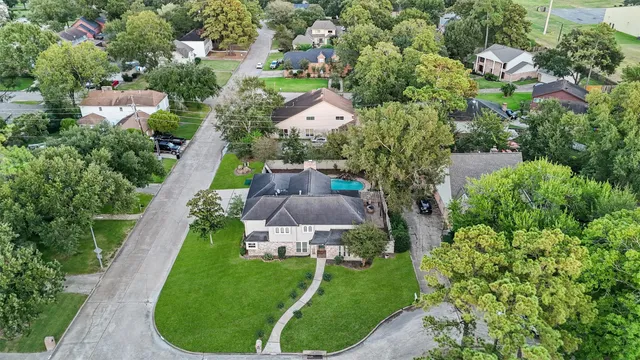an aerial view of a house with a garden