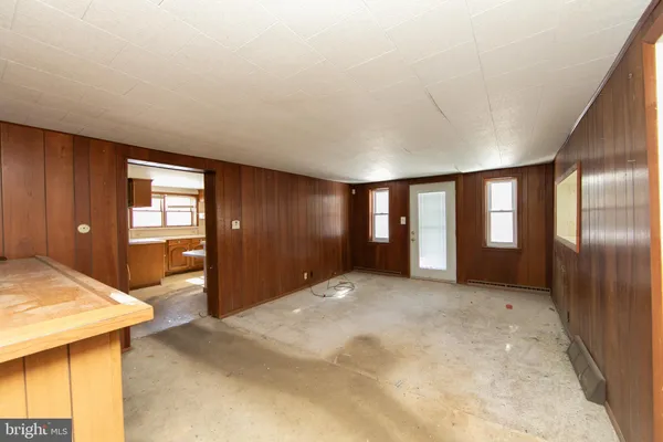 a view of livingroom with kitchen and window