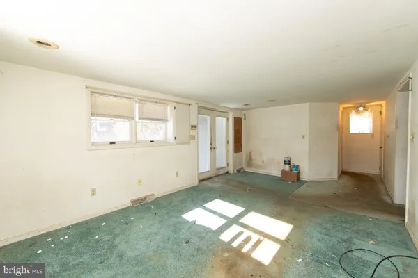 an empty room with windows