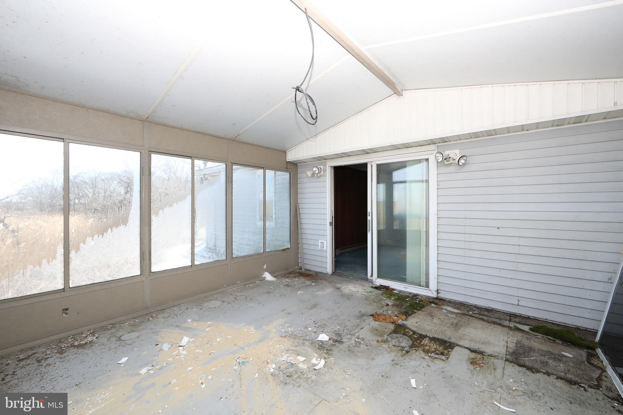 160 Sinnickson Landing Road Salem, NJ 08079 - Photo 34 of 47 Enclosed Back Deck off Primary Bedroom