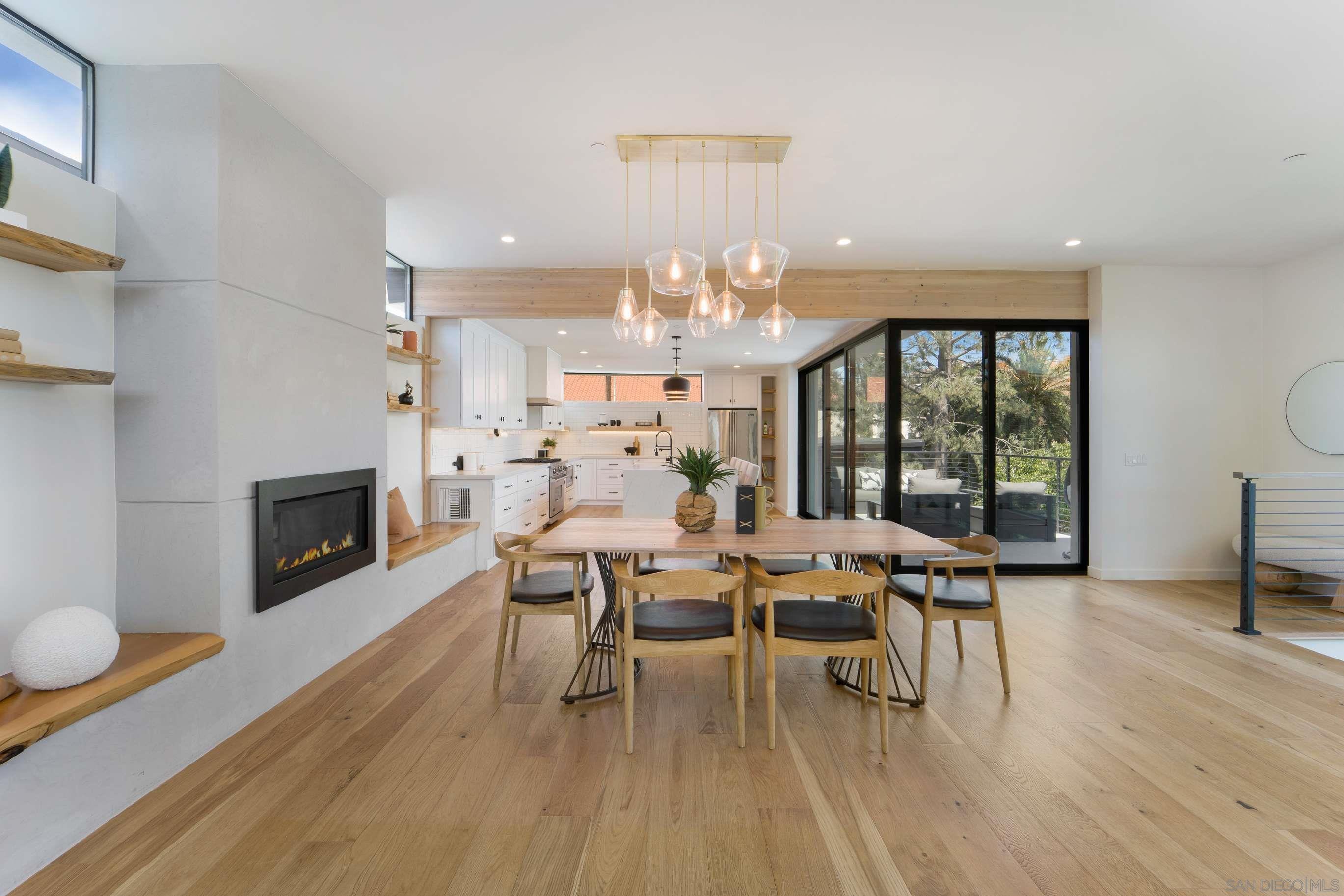 3722 Mississippi Street San Diego, CA 92104 - Photo 1 of 27 a dining room with furniture a fireplace and wooden floor