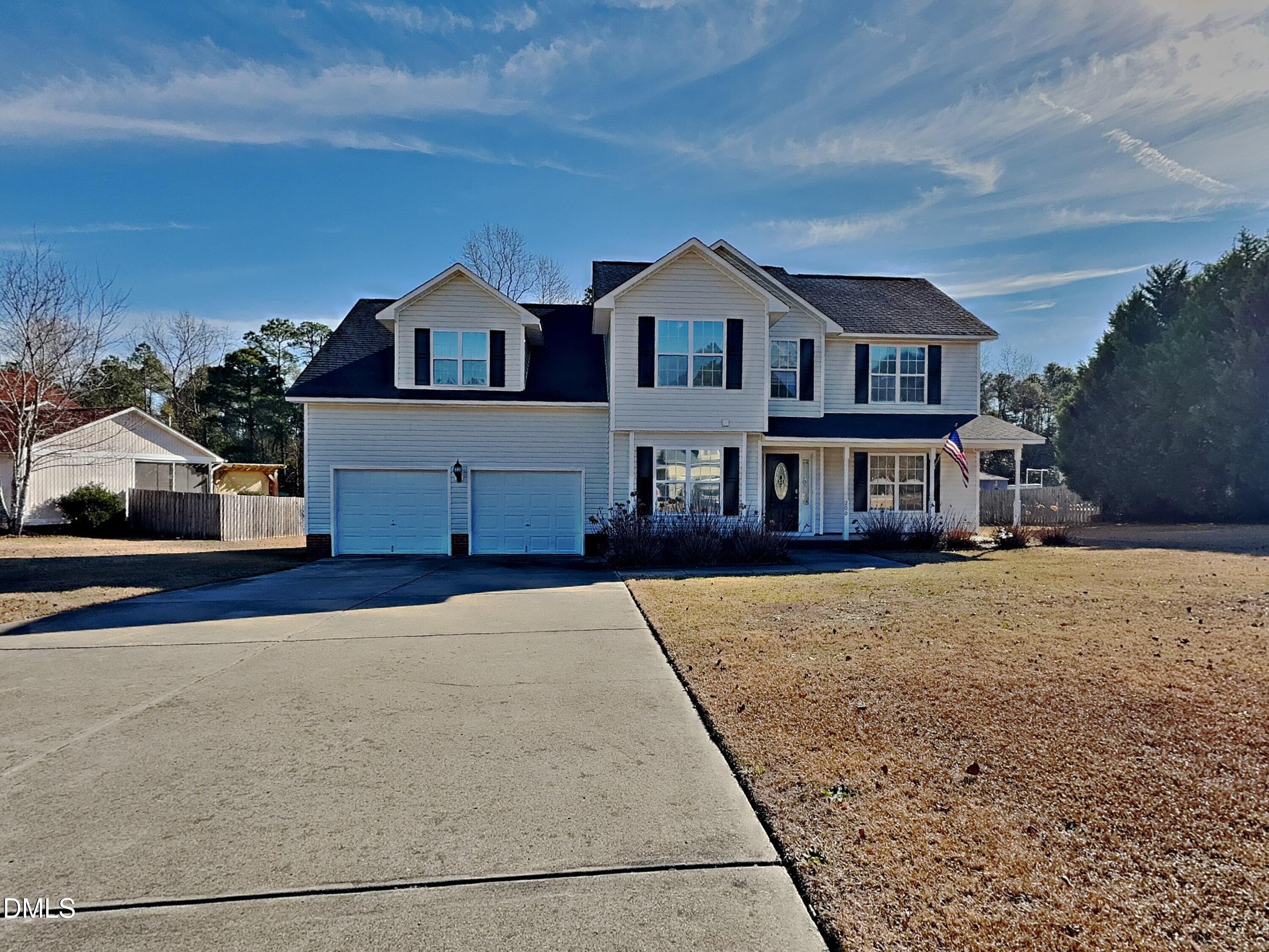 a view of multiple houses with a street