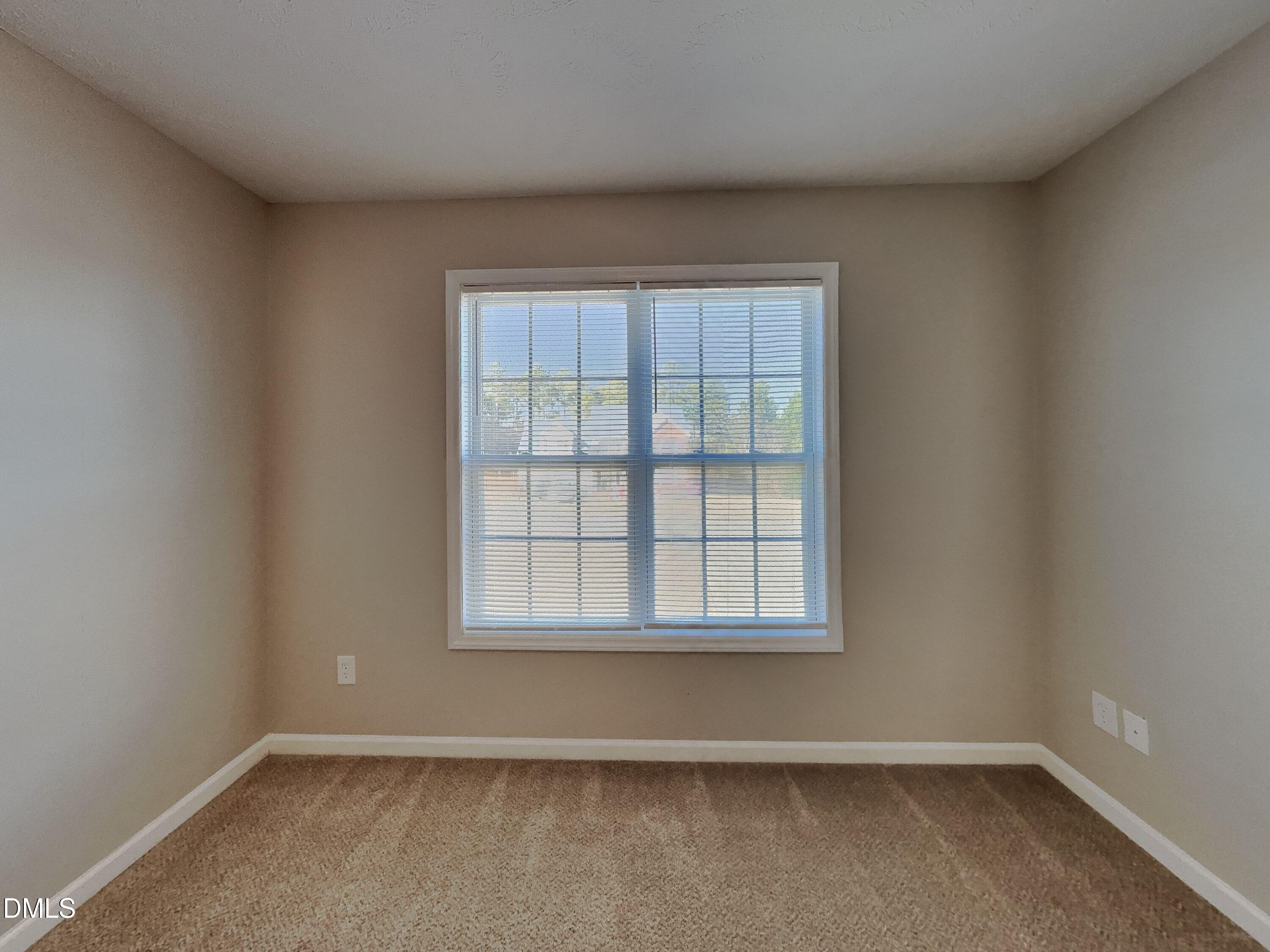 200 Lattimore Road Cameron, NC 28326 - Photo 11 of 21 an empty room with wooden floor and windows