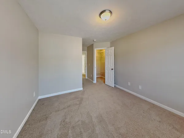 an empty room with a empty space and a window