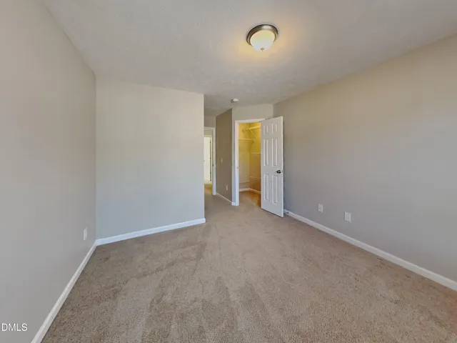 an empty room with a empty space and a window