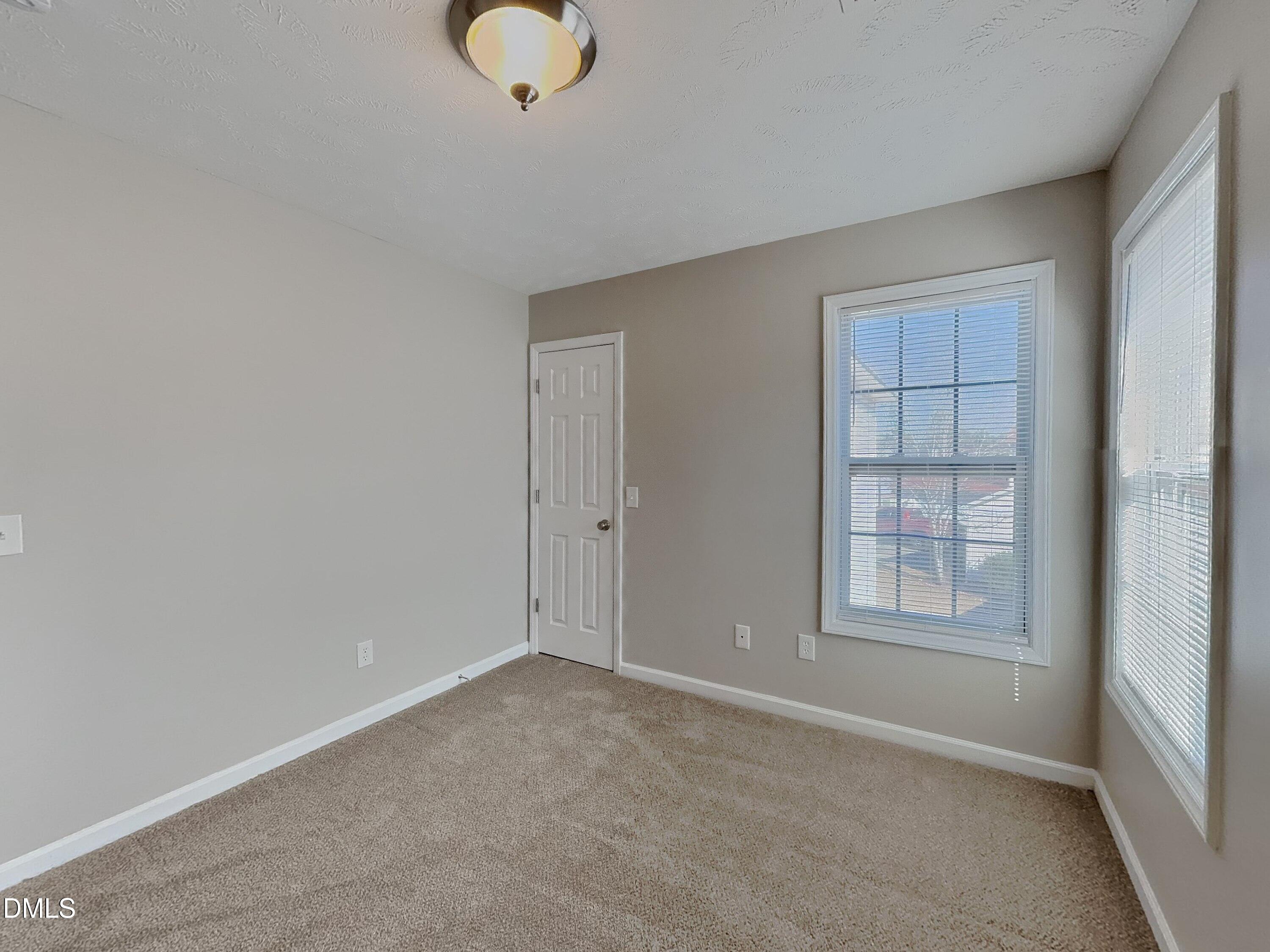 200 Lattimore Road Cameron, NC 28326 - Photo 14 of 21 an empty room with windows and closet