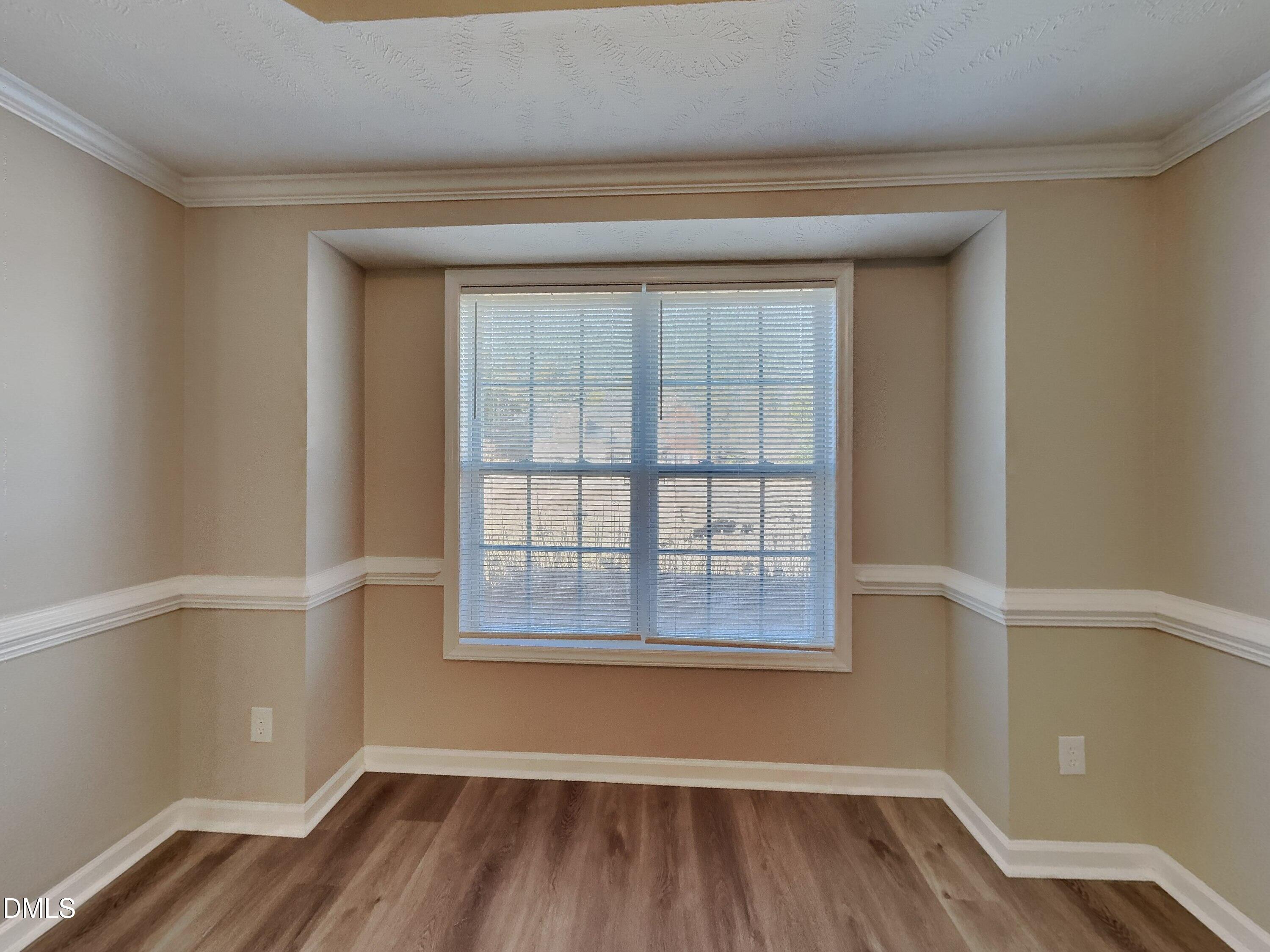 200 Lattimore Road Cameron, NC 28326 - Photo 17 of 21 a view of an empty room with wooden floor and a window