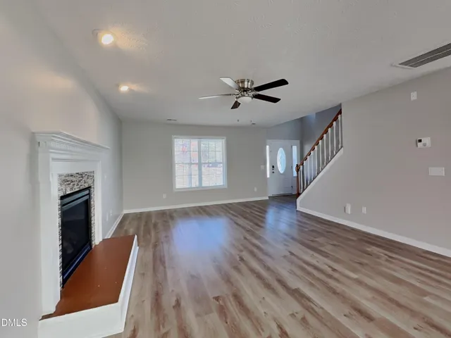 a view of livingroom with hardwood floor and a ceiling fan