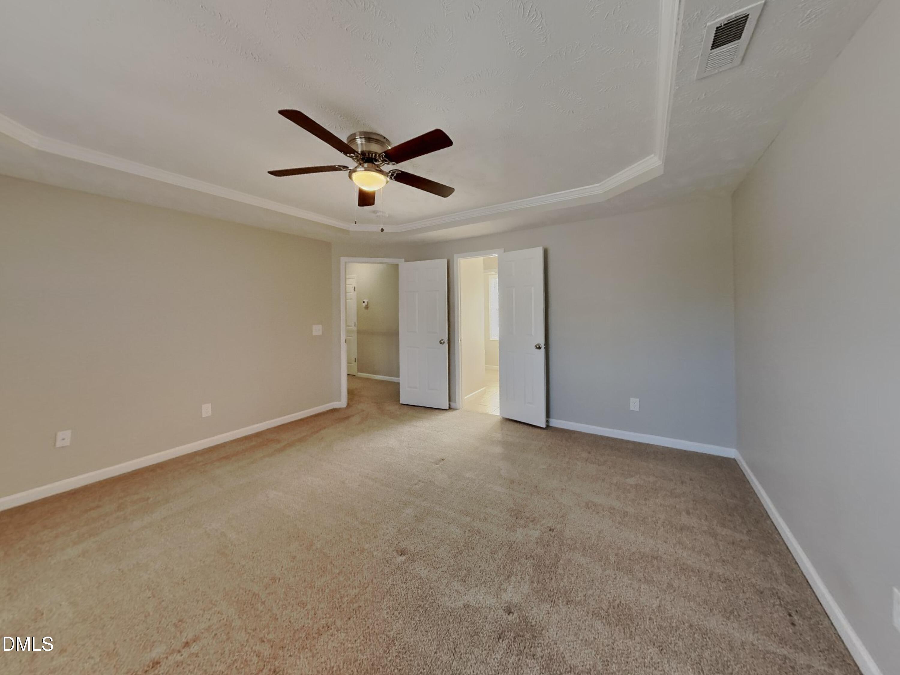 200 Lattimore Road Cameron, NC 28326 - Photo 8 of 21 an empty room with a ceiling fan and a window