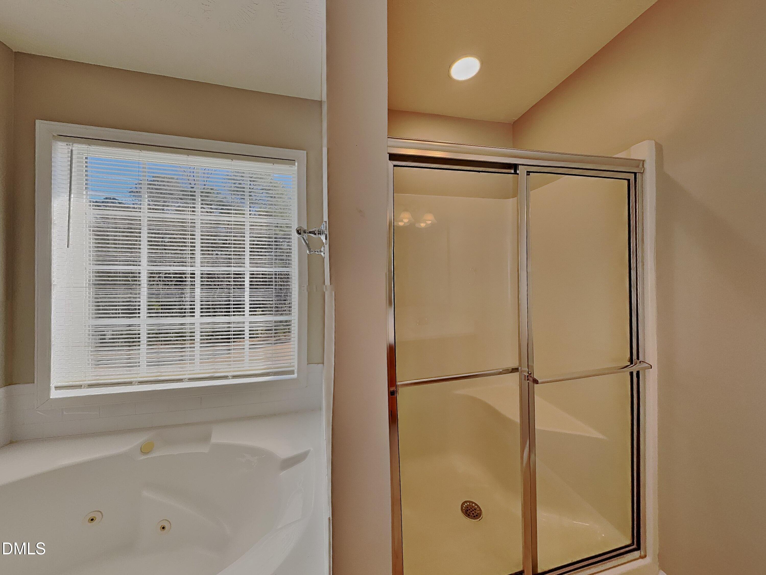200 Lattimore Road Cameron, NC 28326 - Photo 10 of 21 a bathroom with a bathtub and a shower