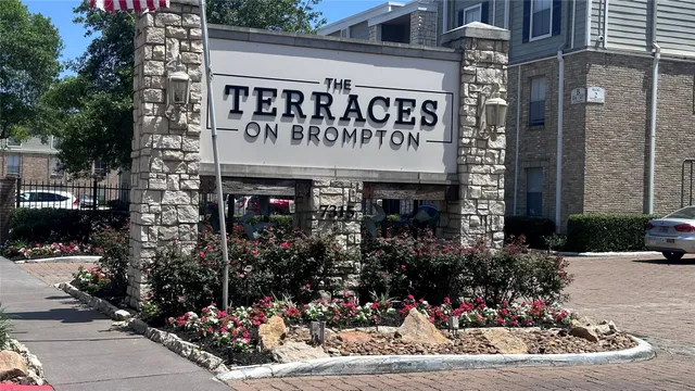 a view of a cafe with a couple of people