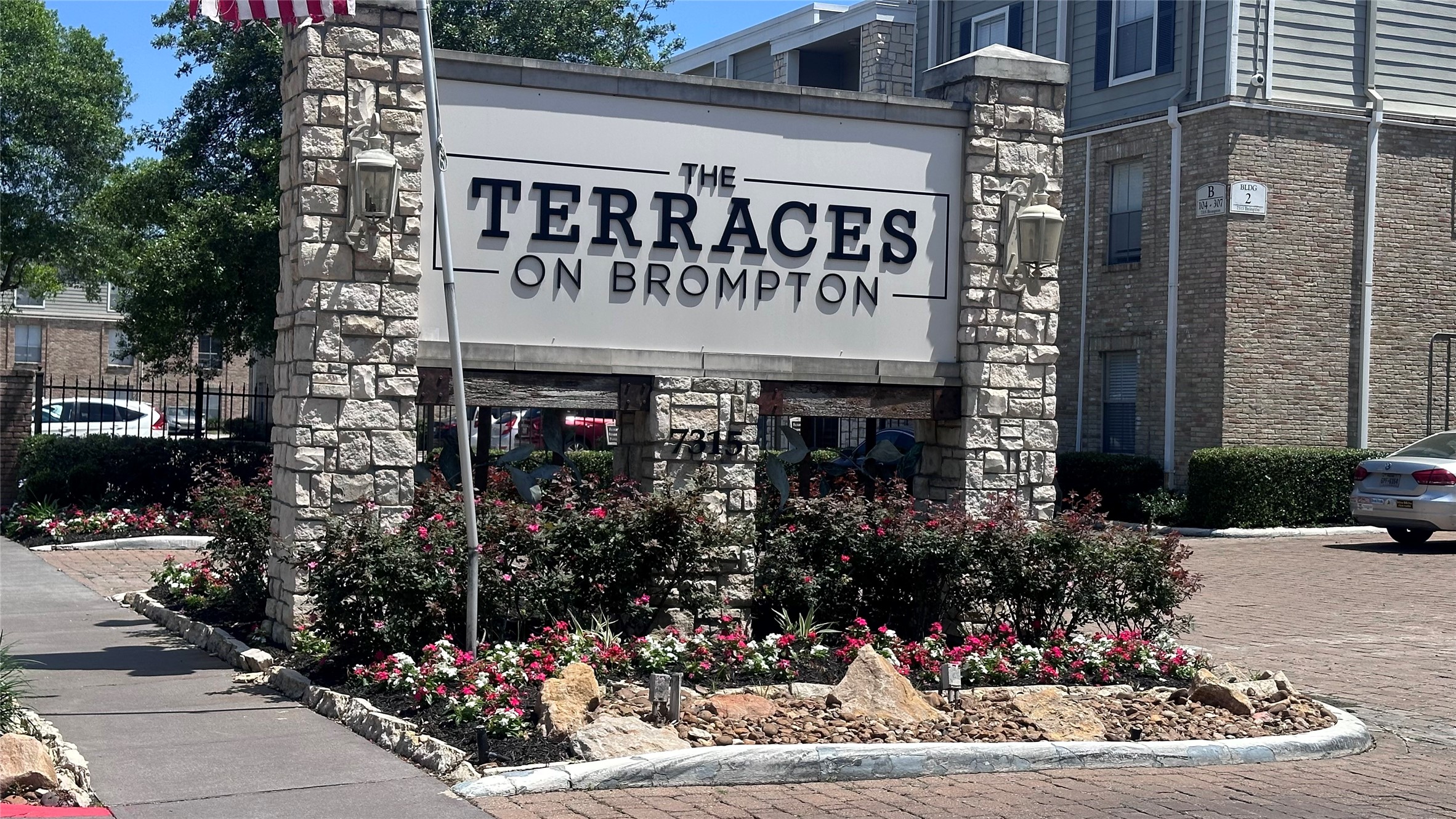 7315 Brompton Street, Unit 247A Houston, TX 77025 - Photo 1 of 13 a view of a cafe with a couple of people