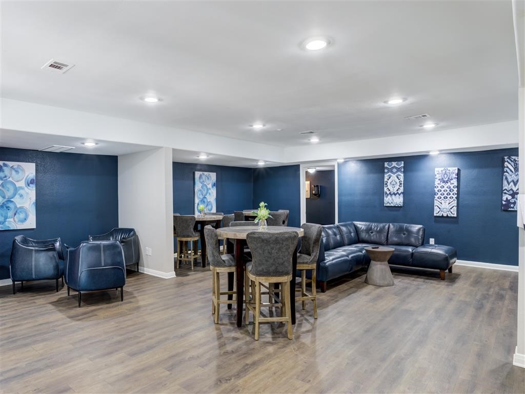7315 Brompton Street, Unit 247A Houston, TX 77025 - Photo 13 of 13 a view of a livingroom with furniture window and wooden floor