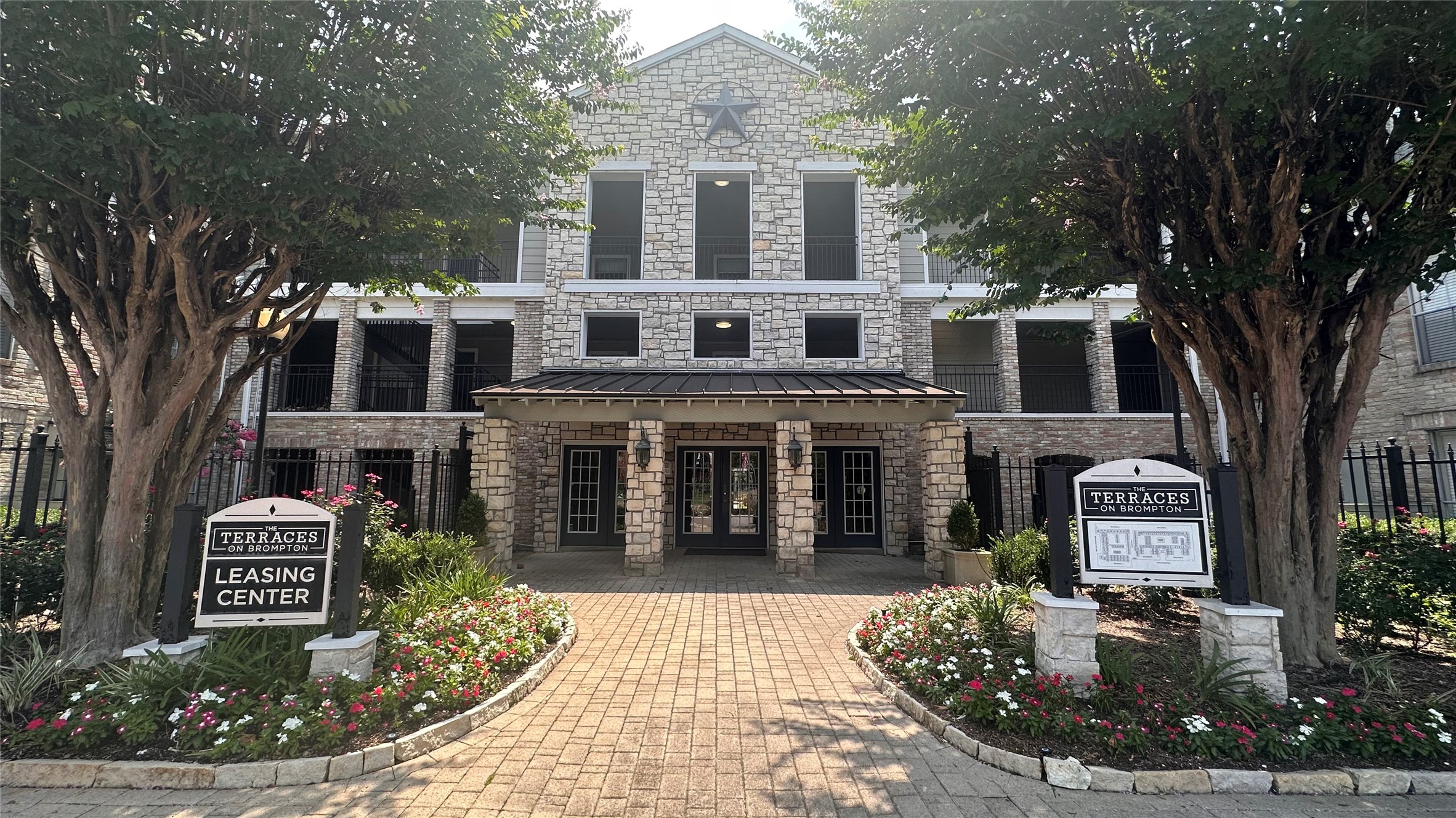7315 Brompton Street, Unit 247A Houston, TX 77025 - Photo 2 of 13 a front view of a house with garden