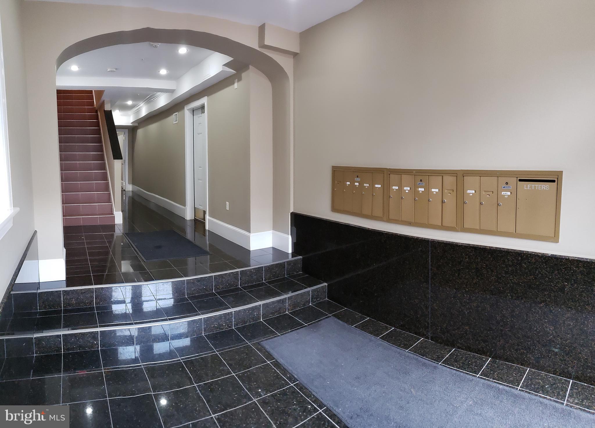 1465 Columbia Road Northwest, Unit 402 Washington, DC 20009 - Photo 5 of 39 Building foyer with marble floors