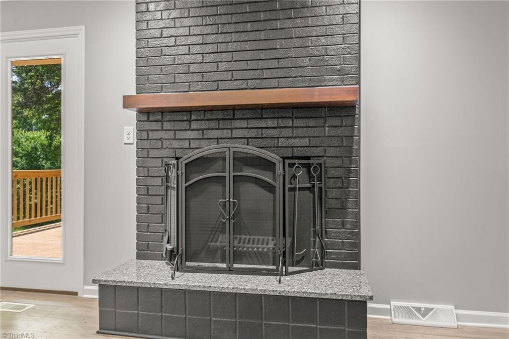 5902 Siler Road Greensboro, NC 27406 - Photo 25 of 49 Fireplace and chimney have been inspected, repaired, and is ready to use. There is a new chimney cap to keep your furry & feathery friends from making this home theirs!