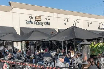 a view of people sitting in front of shop