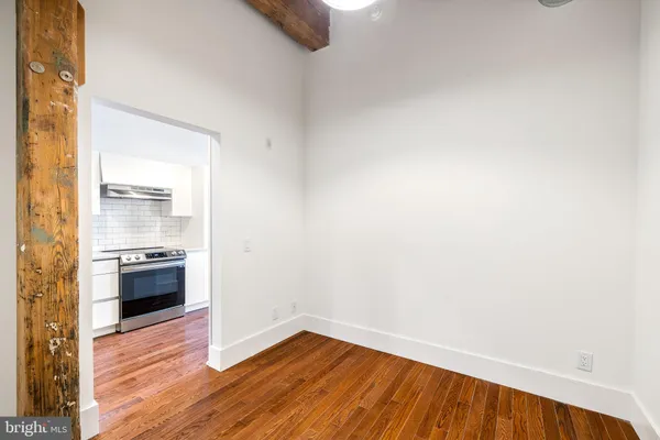 a view of a kitchen cabinets and wooden floor