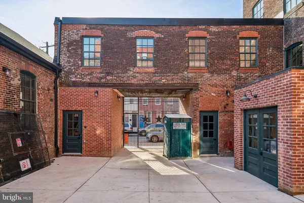 a view of a brick building with many windows