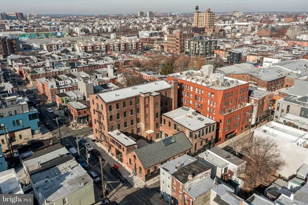 an aerial view of a house with a city view