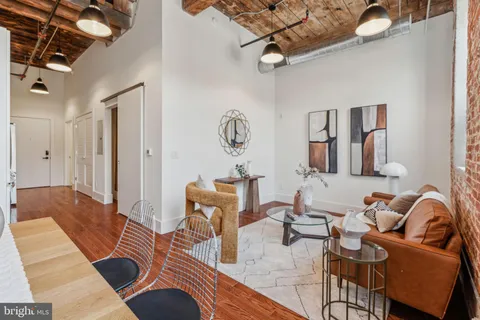 a living room with furniture and a table