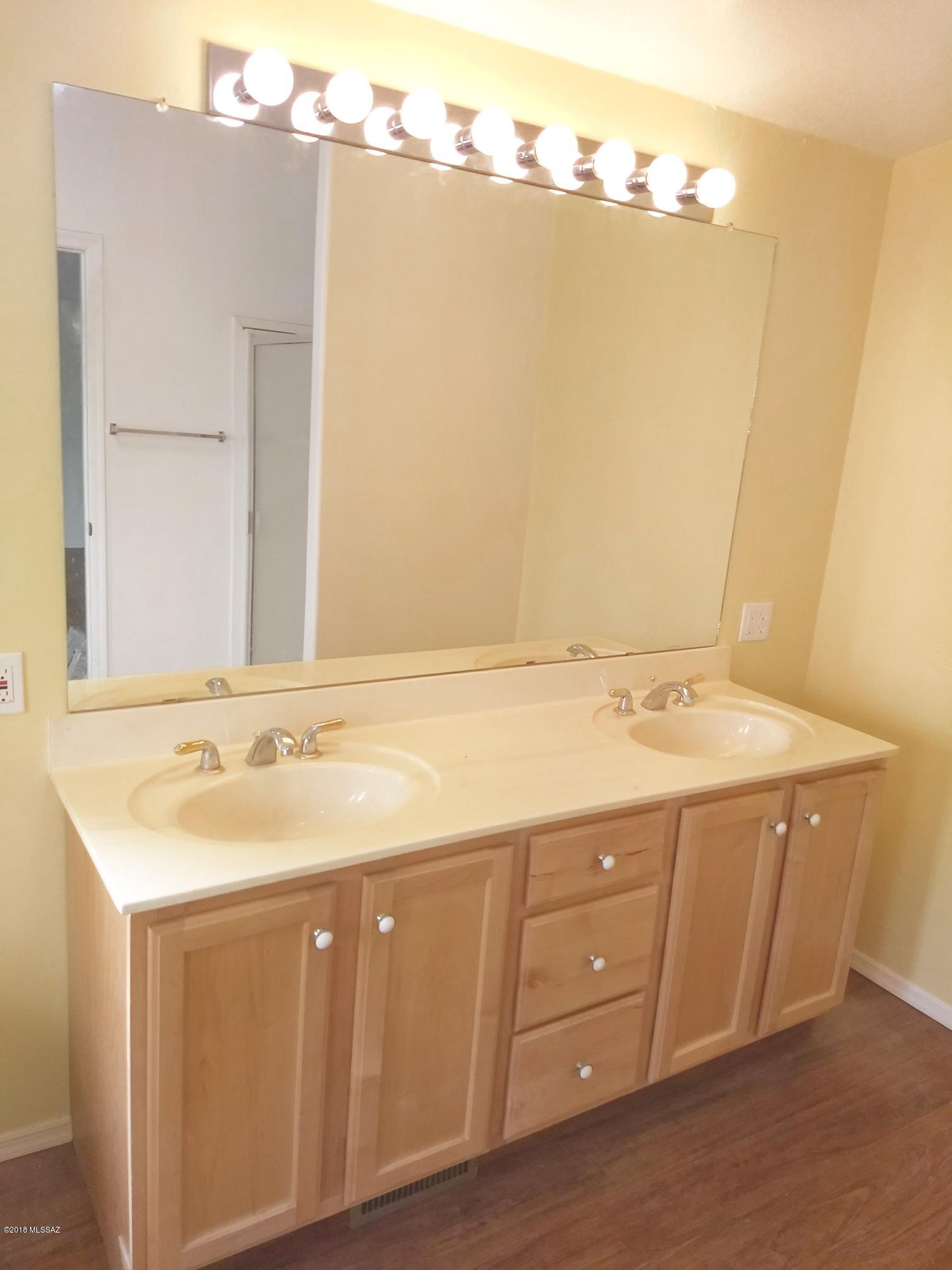 7420 West Bopp Road Tucson, AZ 85735 - Photo 26 of 39 a bathroom with a sink and mirror