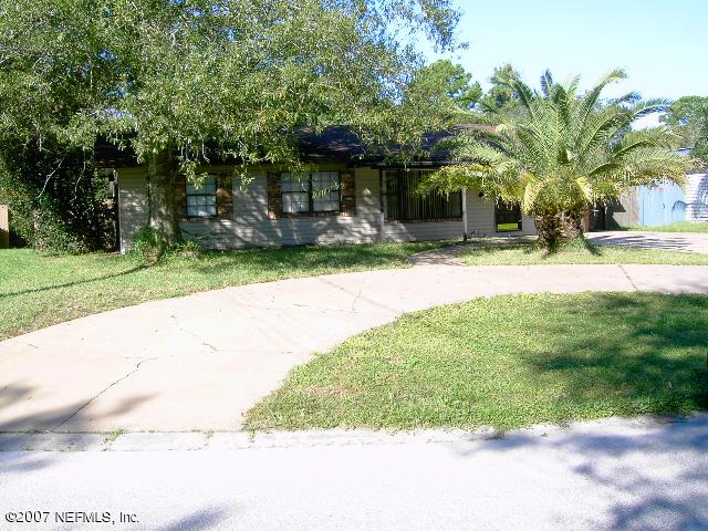 1201 Hibiscus Street St. Augustine, FL 32084 - Photo 1 of 16 a front view of a house with a yard and a garage