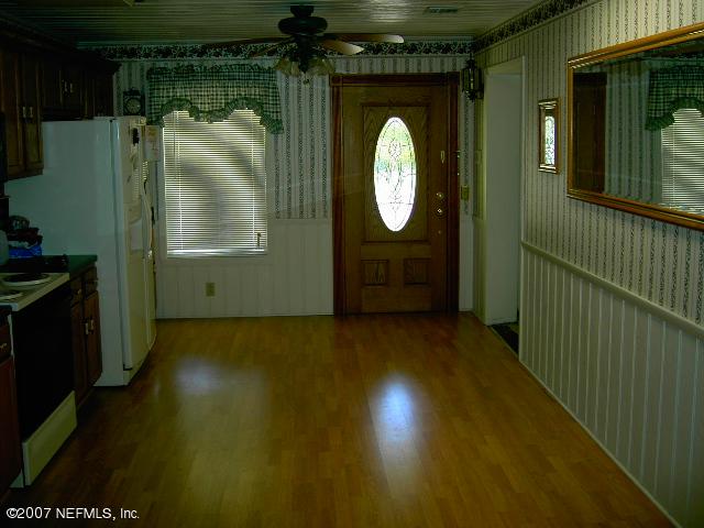 1201 Hibiscus Street St. Augustine, FL 32084 - Photo 8 of 16 a view of a small space with wooden floor and a window