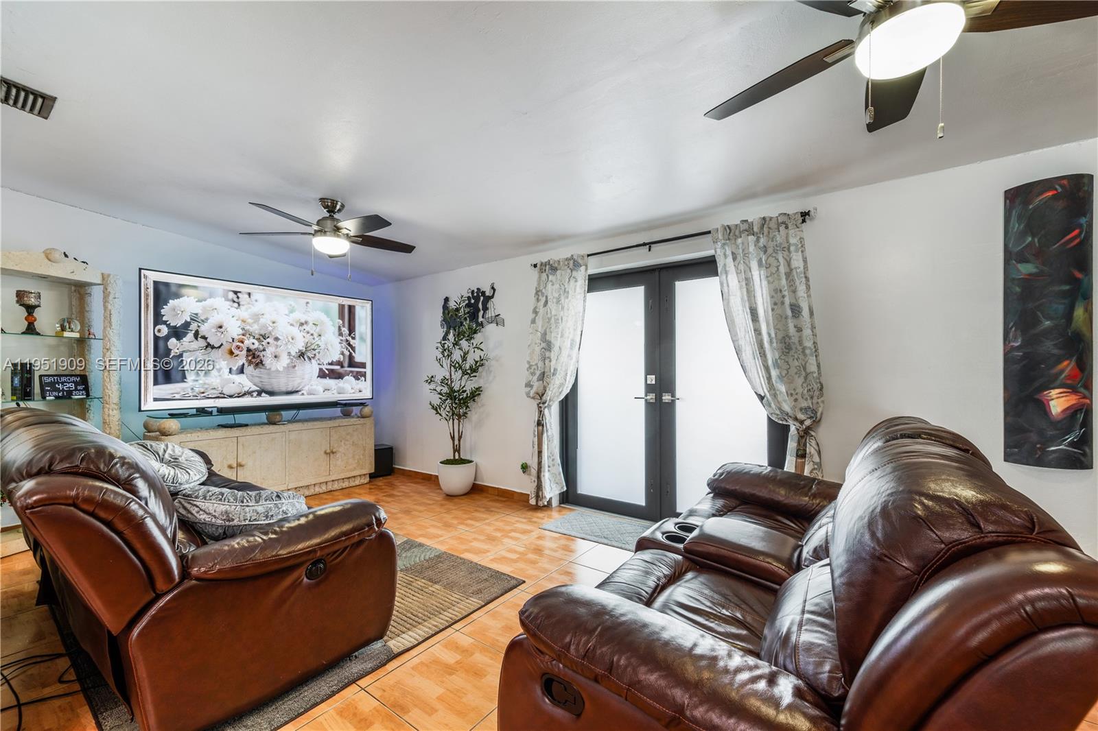 8065 West 14th Court Hialeah, FL 33014 - Photo 34 of 44 Second Living Room/Area w/Doors to Patio/Backyard