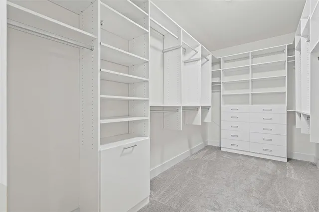 a spacious bathroom with double sink and a mirror