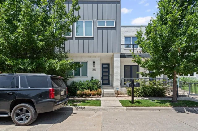 a view of a car is parked in front of a house